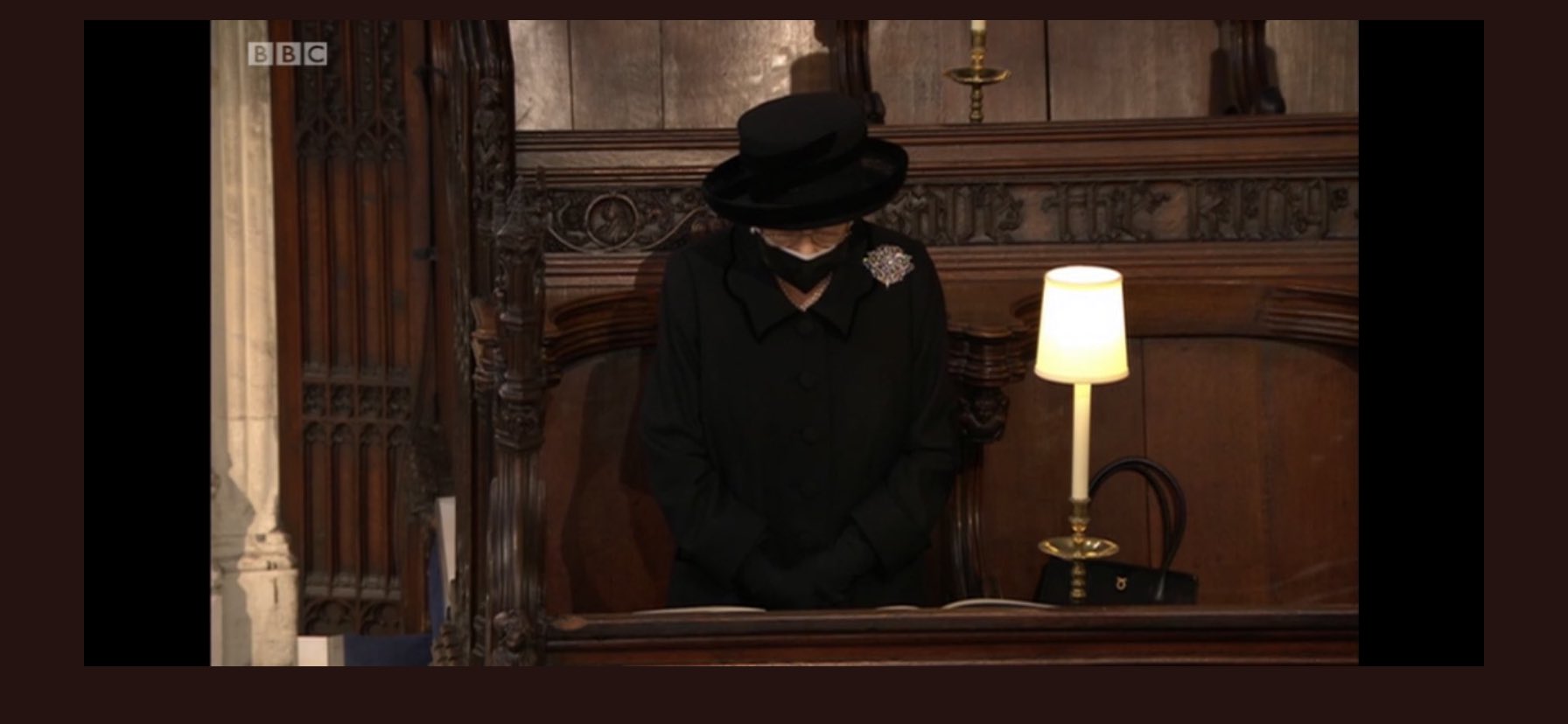 Prince Philip is laid to rest as somber queen sits alone