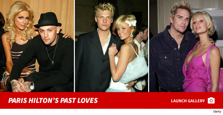 Paris Hilton Has a Roll in the Sand with New Dude (Photo Gallery)