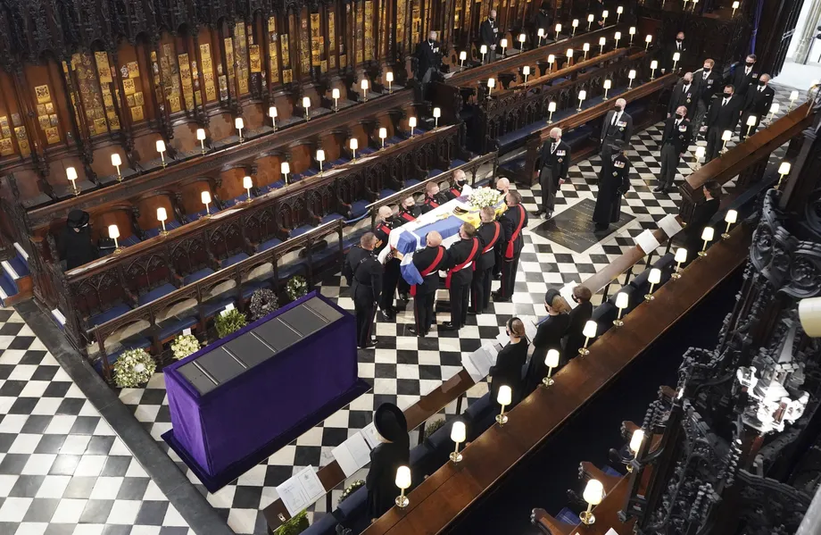 Prince Philip is laid to rest as somber queen sits alone