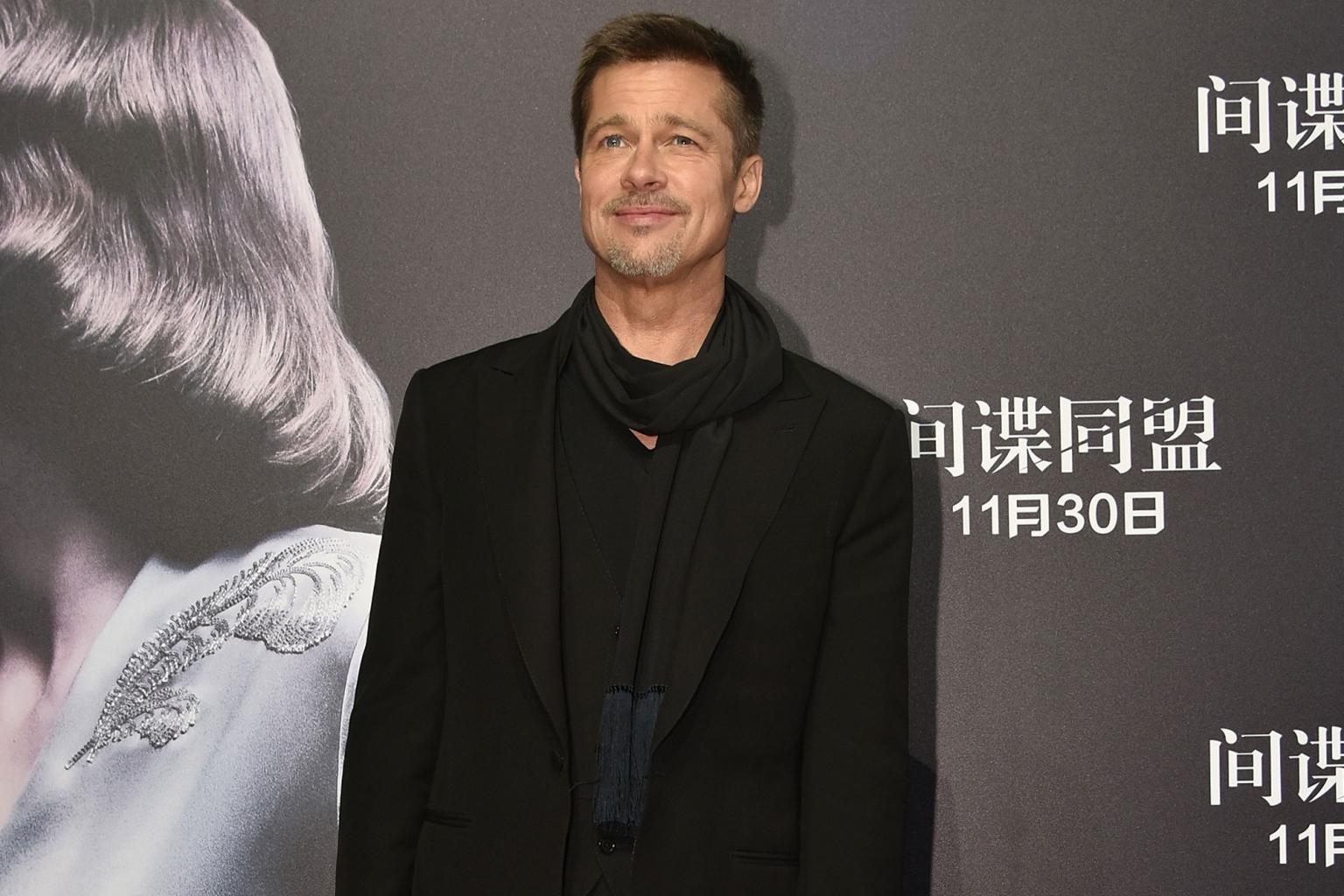 Brad Pitt Delights Fans in China on the Allied Red Carpet
