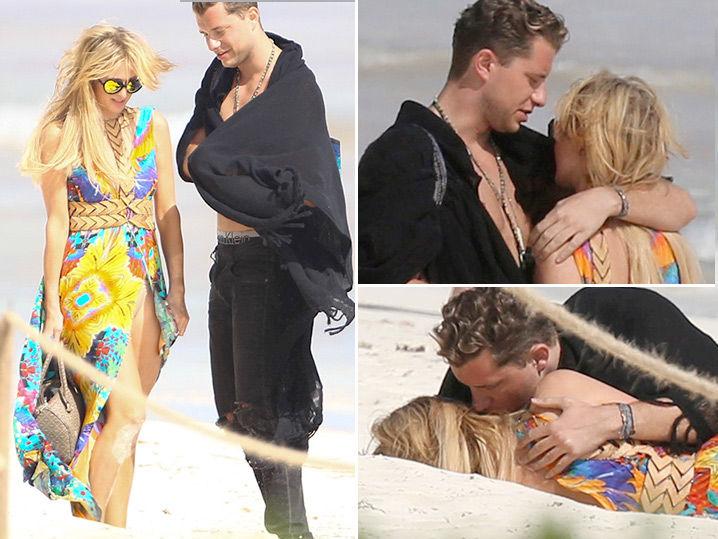 Paris Hilton Has a Roll in the Sand with New Dude (Photo Gallery)