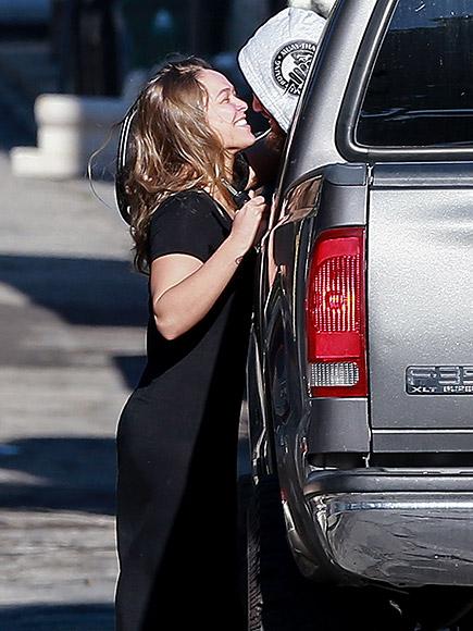 Ronda Rousey and Travis Browne Share a Sweet Parking Lot Smo