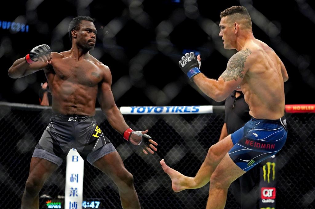 UFC 261 Chris Weidman snaps leg throwing kick vs Uriah Hall same way he beat Anderson Silva - Video