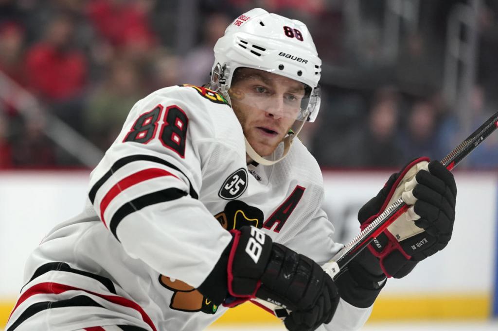 Patrick Kane is signing with the Detroit Red Wings an AP source says