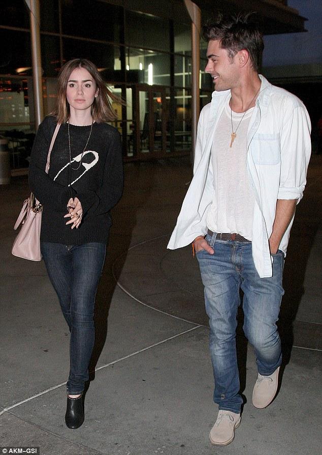 Back together? Zac Efron and Lily Collins pictured on Disneyland ride