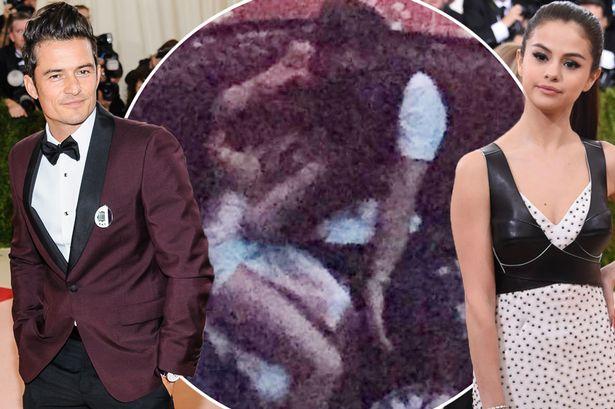 Selena Gomez and Orlando Bloom pictured all over each other in smoking