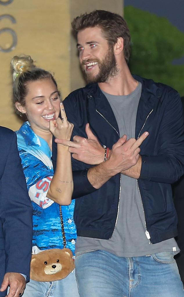 Miley Cyrus & Liam Hemsworth Are All Smiles As They Make Obscene