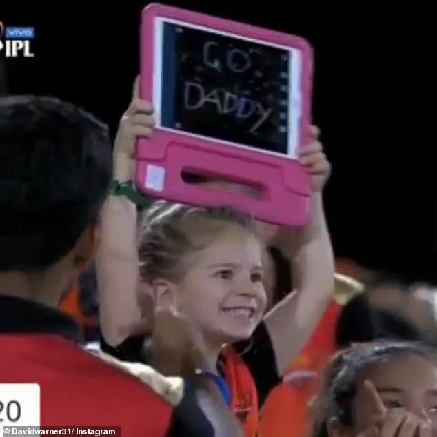 David Warner's daughter Ivy Mae, 4, holds up a 'Go Daddy