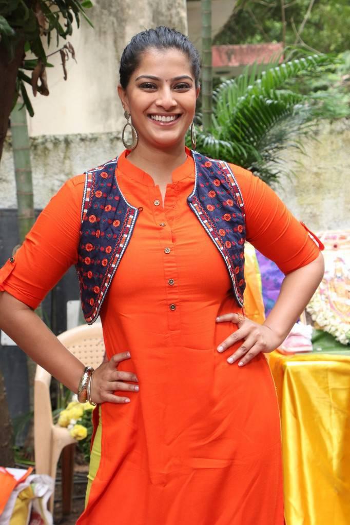 Varalaxmi Sarathkumar Photos In Orange Dress - Tollywood Boost