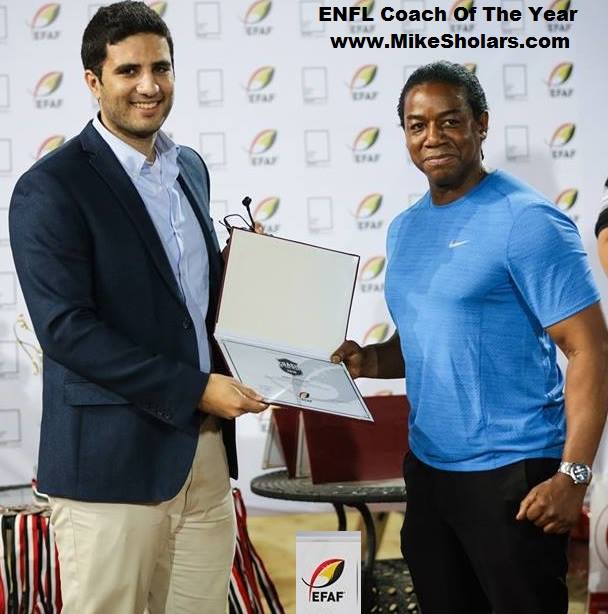 Coach Mike Sholars (Right) Receiving the ENFL Coach Of The Year Award